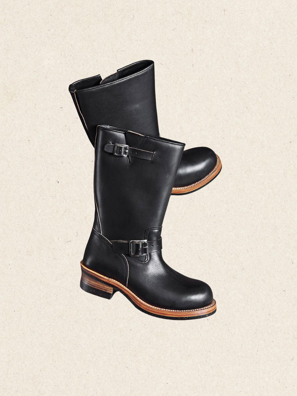 Pair of de-waxed black calfskin engineer boots with a 29 cm shaft and tan welt
