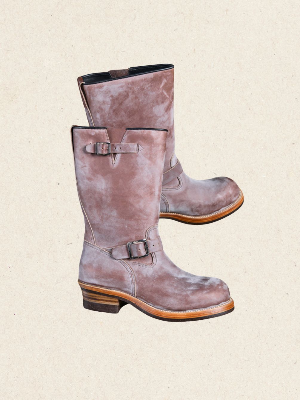 Pair of waxed calfskin engineer boots in HAAS leather with a pale wax bloom across the surface
