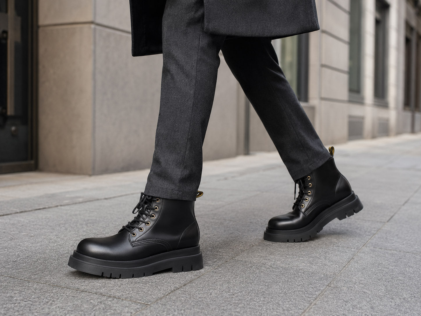 Black Hector Maden leather boots worn with charcoal trousers
