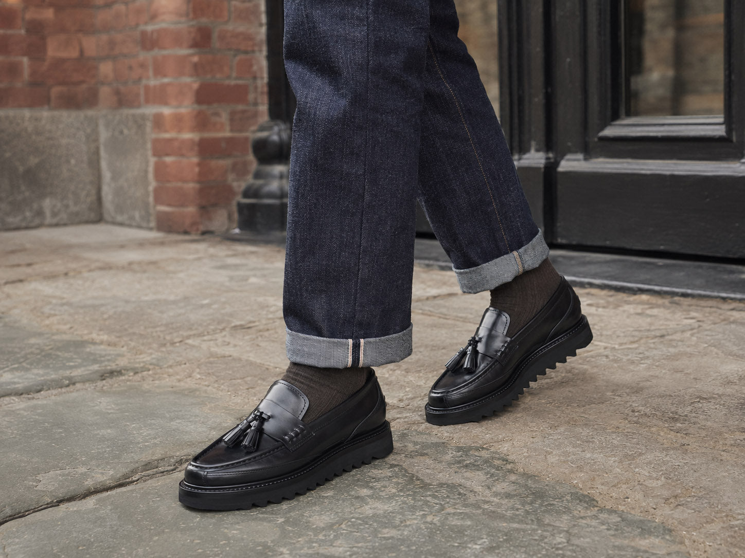 Black Hector Maden loafers worn with cuffed denim