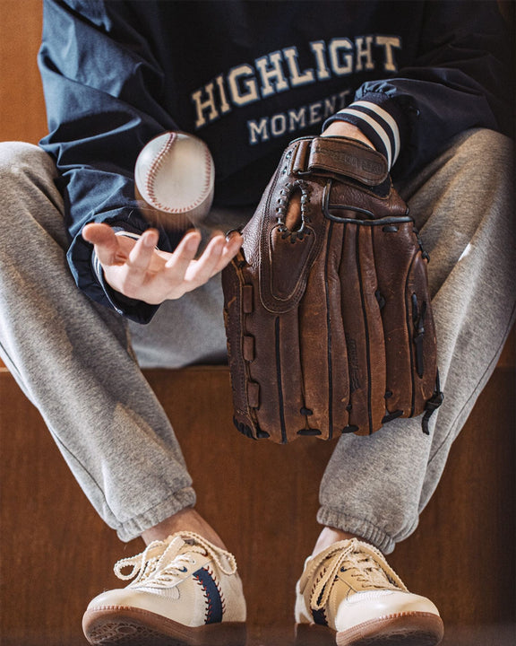 Hector Maden retro sneakers styled with baseball-inspired casualwear